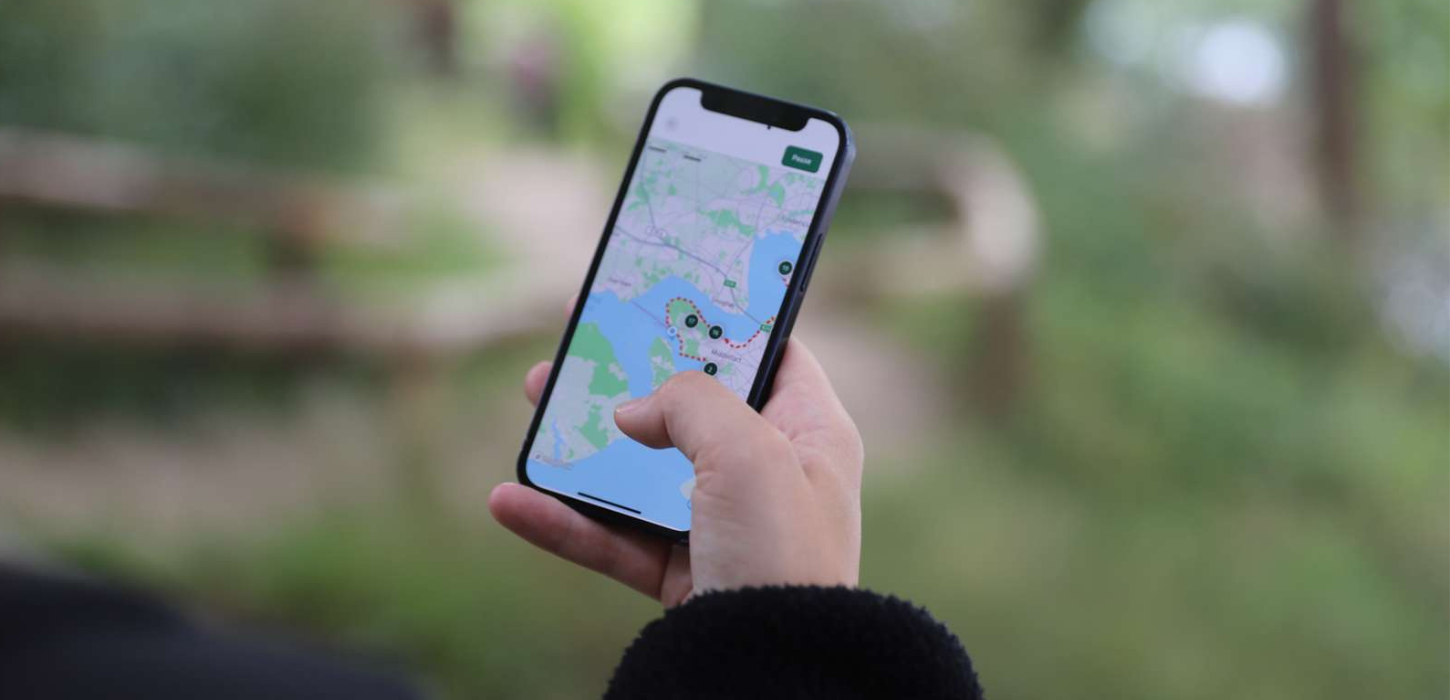 Billede af vandrepas appen i brug på en telefon